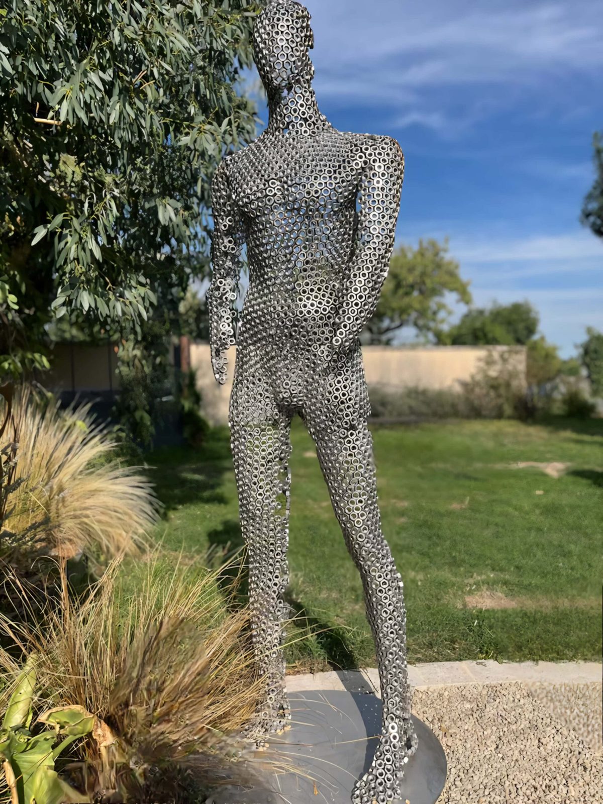 L’Homme Inoxydable — sculpture, C Design Mobilier